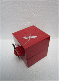 square box with dragonfly key